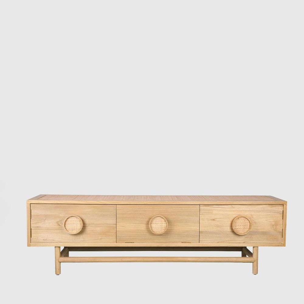 Wooden coffee table with three circular handles on a light gray background