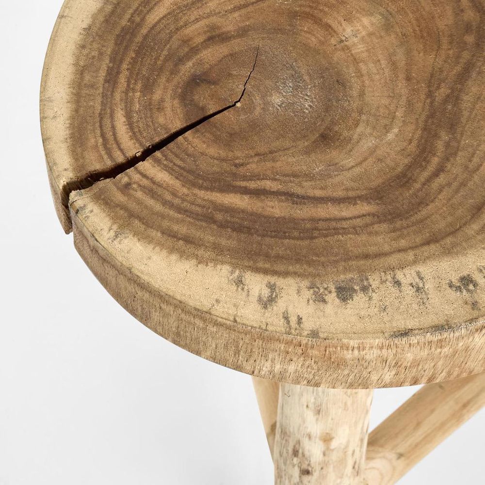 Wooden stool with a natural, rustic finish on a white background. There is a crack in the timber to the top of the stool