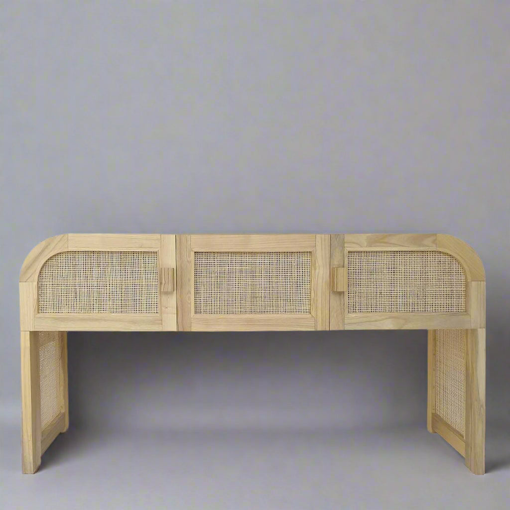 Wooden cabinet with rattan doors on a grey background