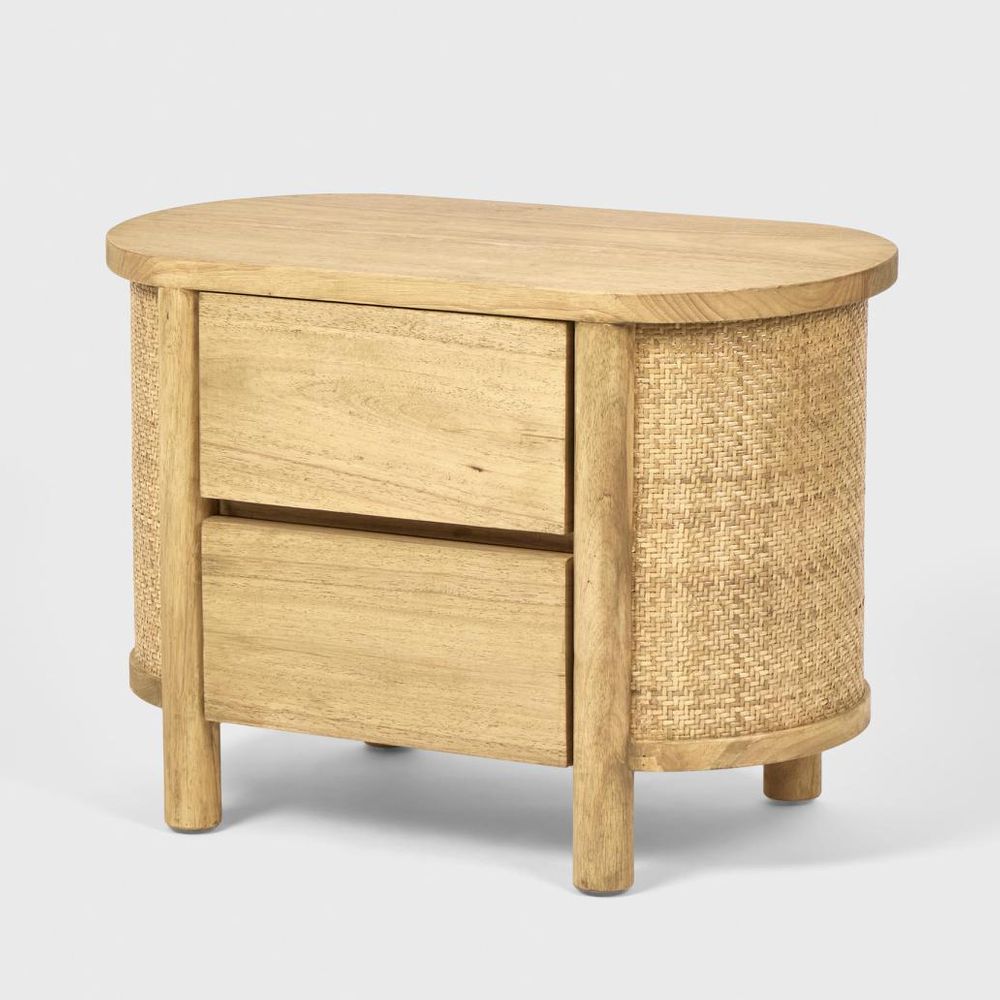 Wooden side table with wicker accents on a white background