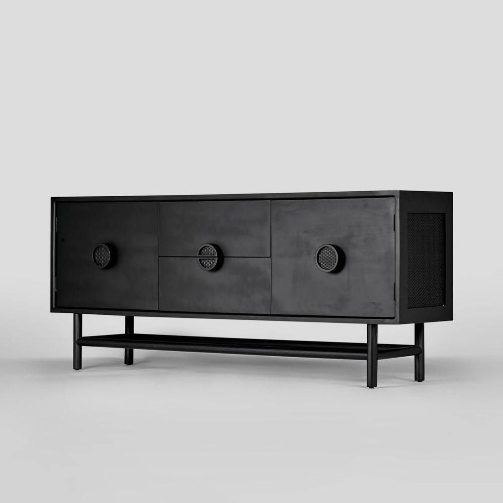Black wooden sideboard with circular handles on a light gray background